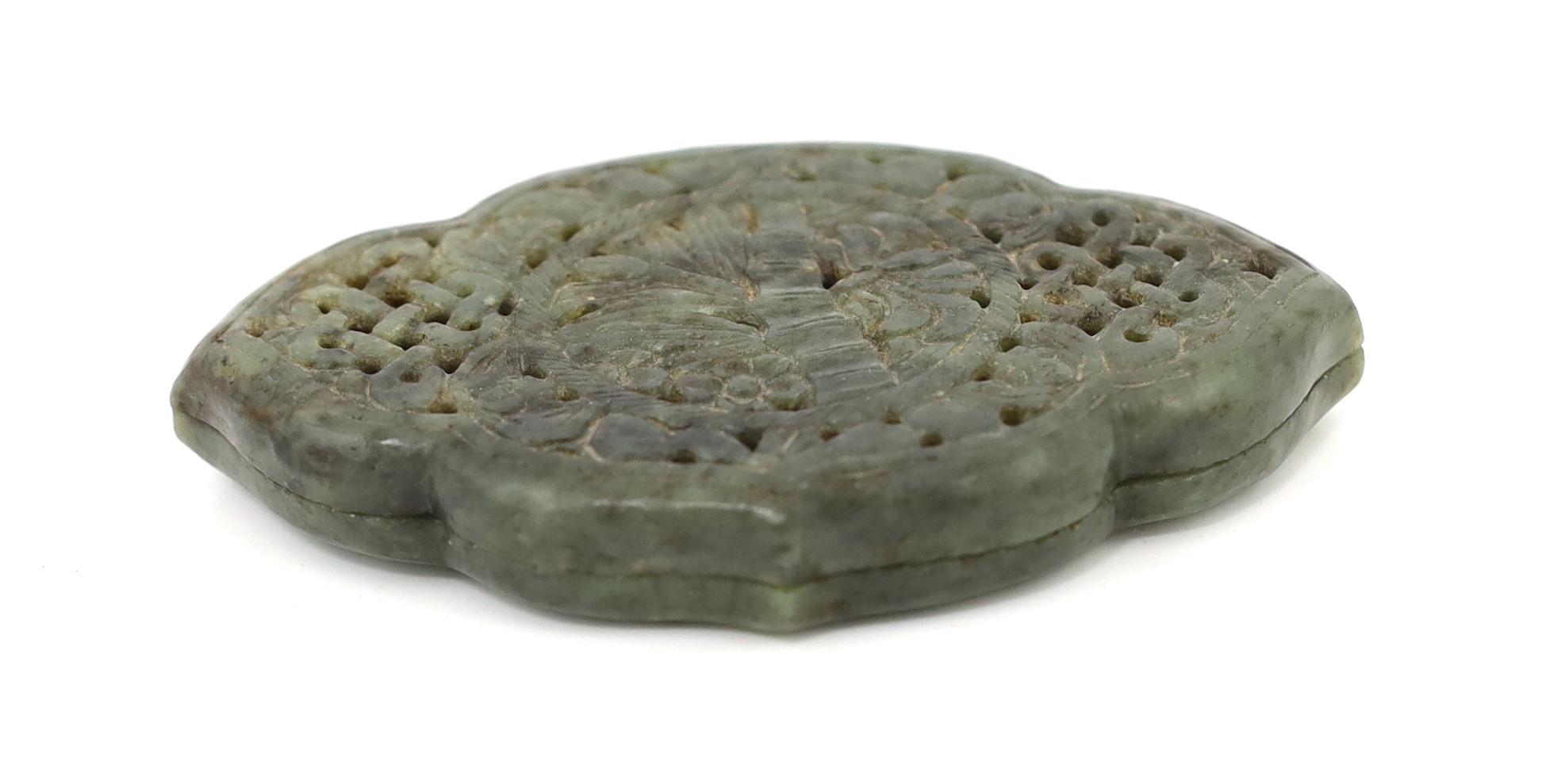 A Chinese reticulated mottled green jade box and cover, Qing dynasty, the cover carved and pierced with bamboo, bats and endless knots, 13cm across. Condition - old chipping to the inner rim of the base and one end, othe